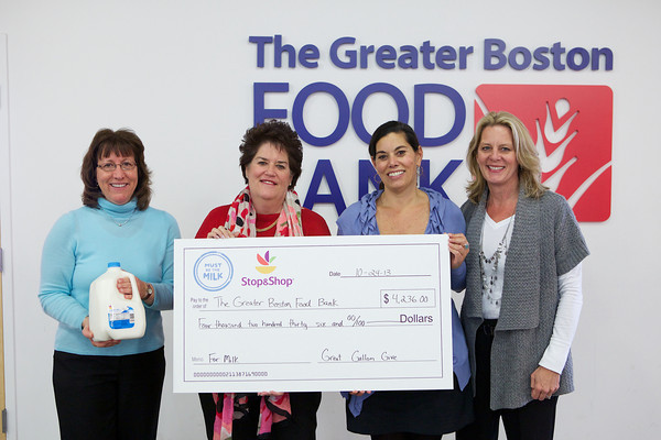 LH, Judie, GBFB Check Presentation in front of logo