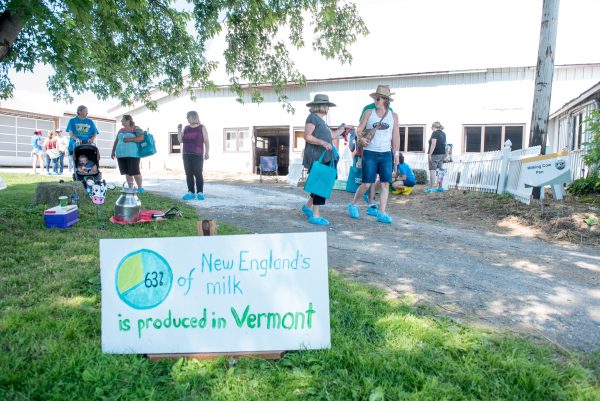 Visitors with Milk Sign