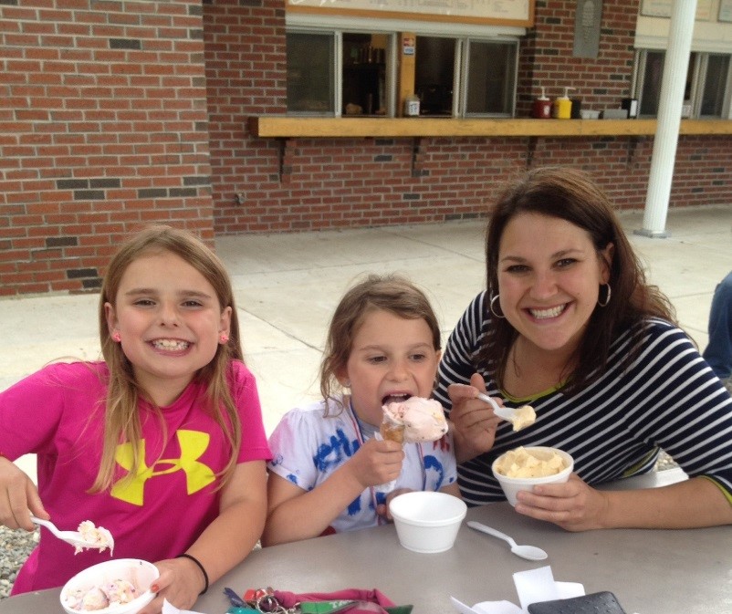 mom and daughters eating ice crea